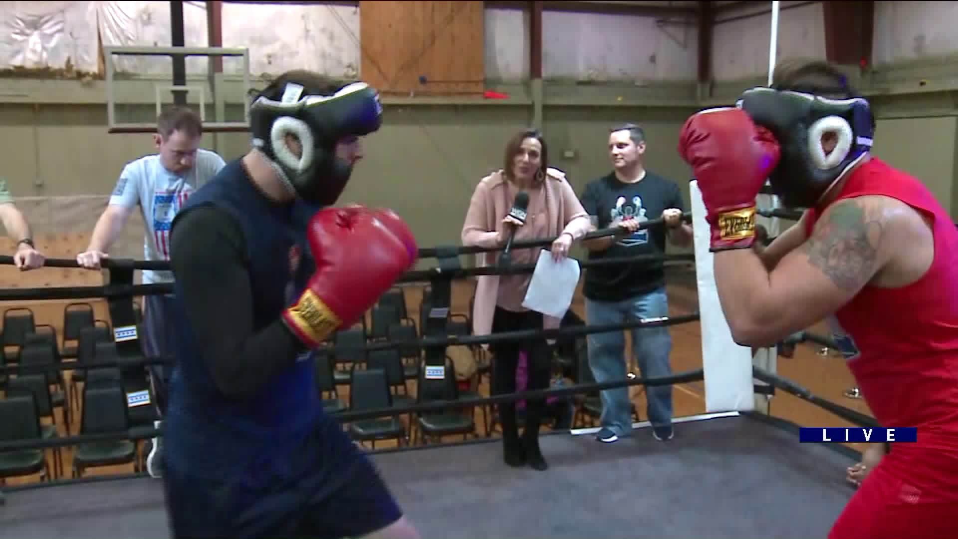 Around Town cheers on Police Officers and Firefighters as they face off in a boxing match